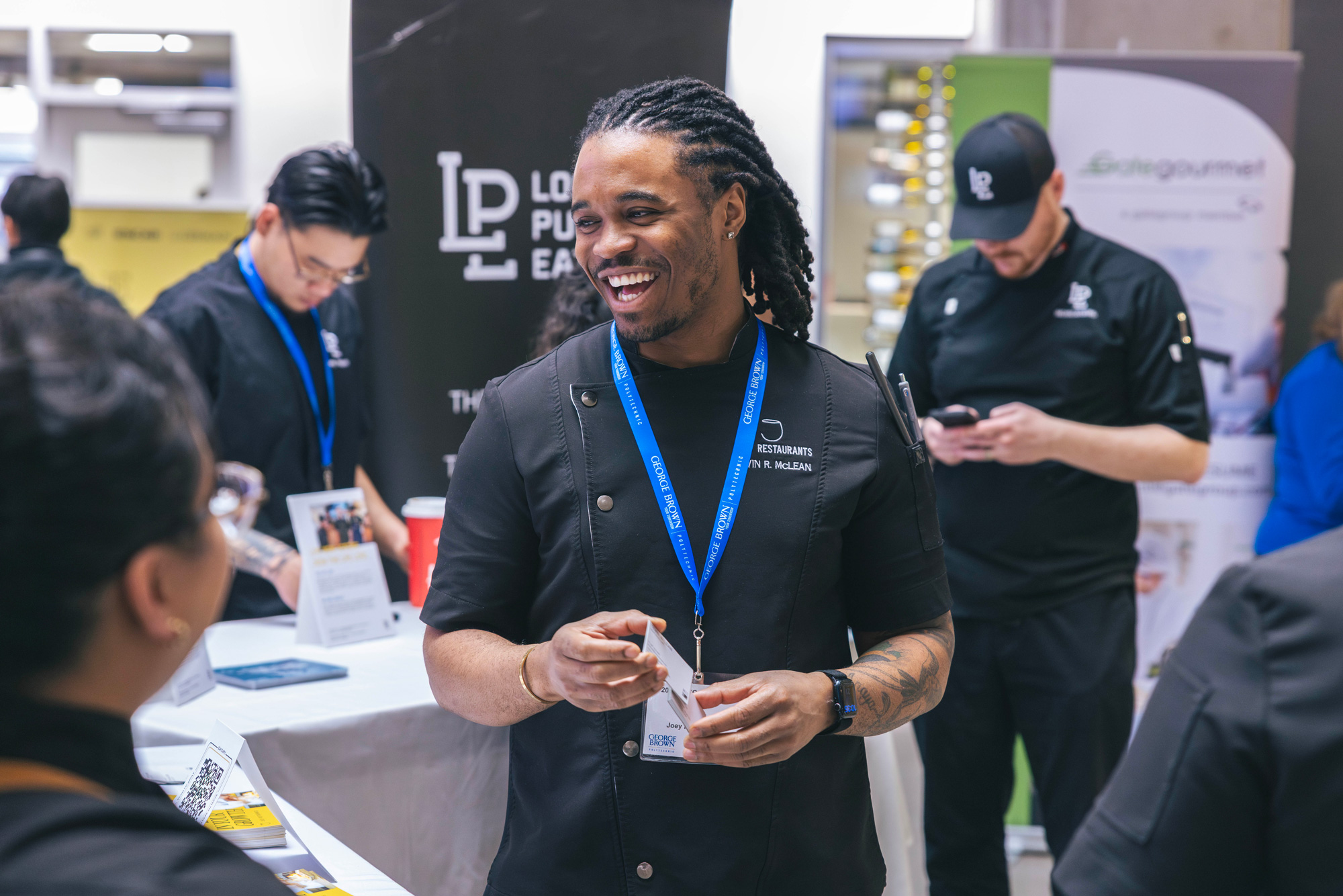 A chef from Joey Restaurants chats with students