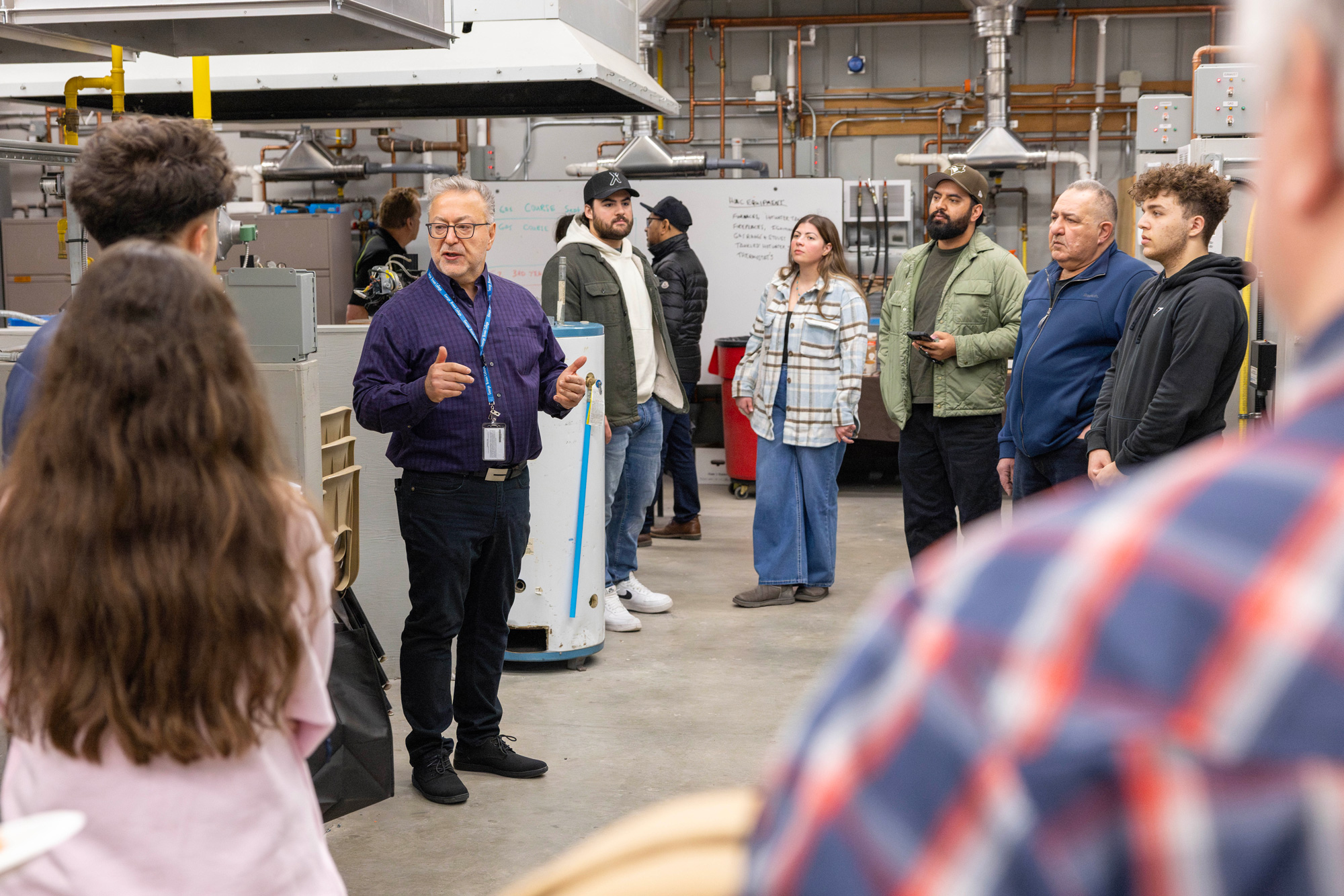 Guests tour skilled trades labs at the spring open house