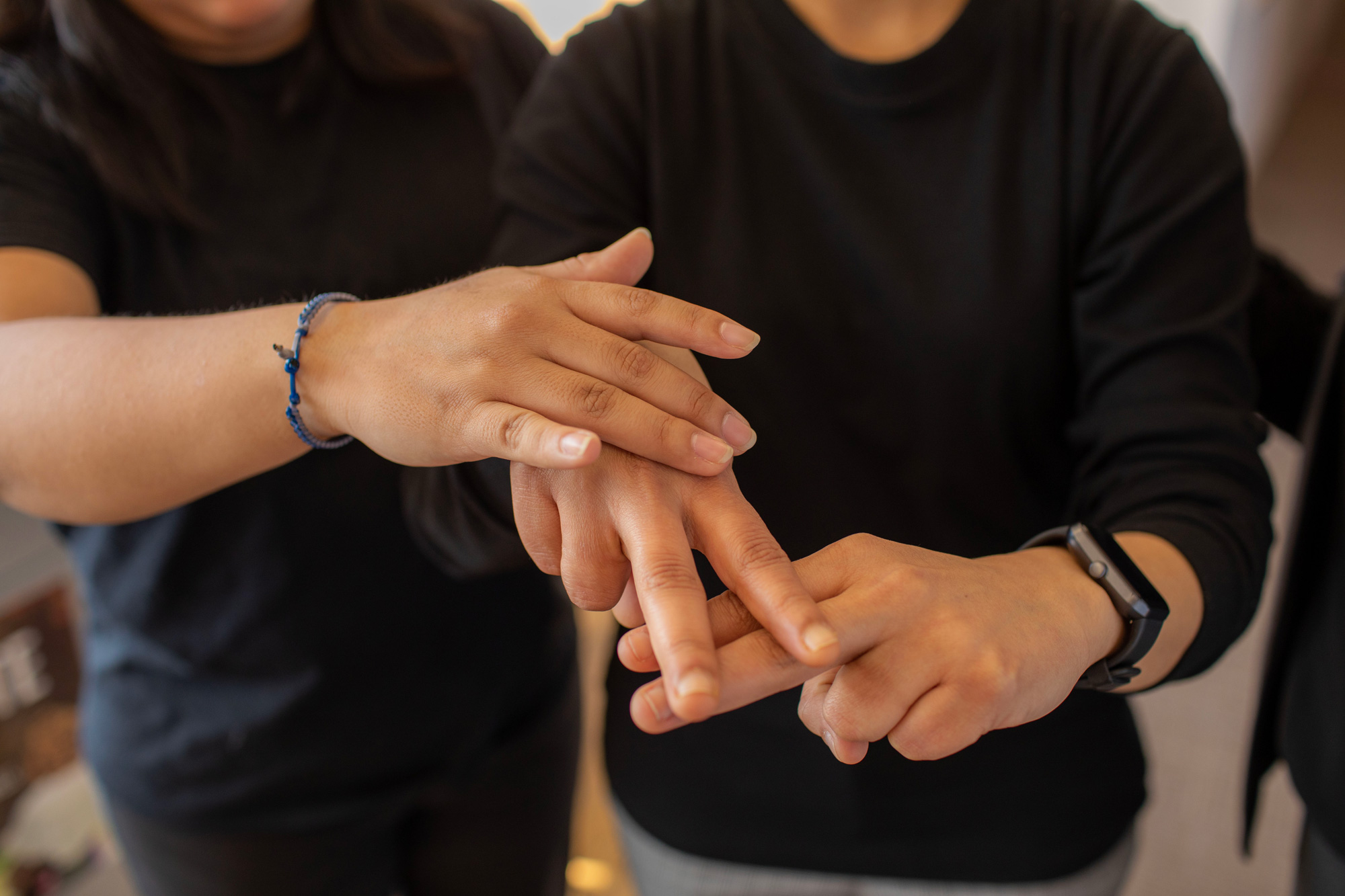 George Brown Polytechnic students in the Deafblind Intervenor program practicing tactile communication and hand-under-hand techniques.
