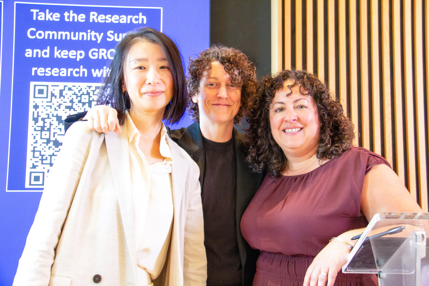 Research and Innovation speakers at the GROW Symposium pose next to the podium