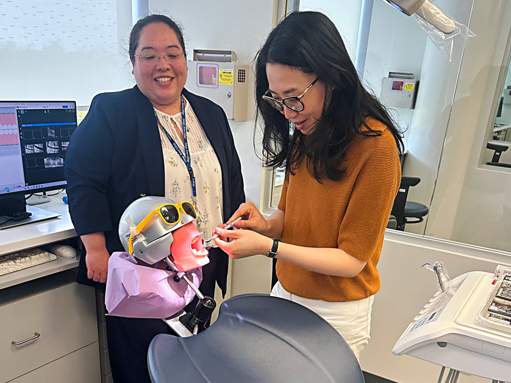 MP Maggie Chi tries out a dental manikin in a simlution lab