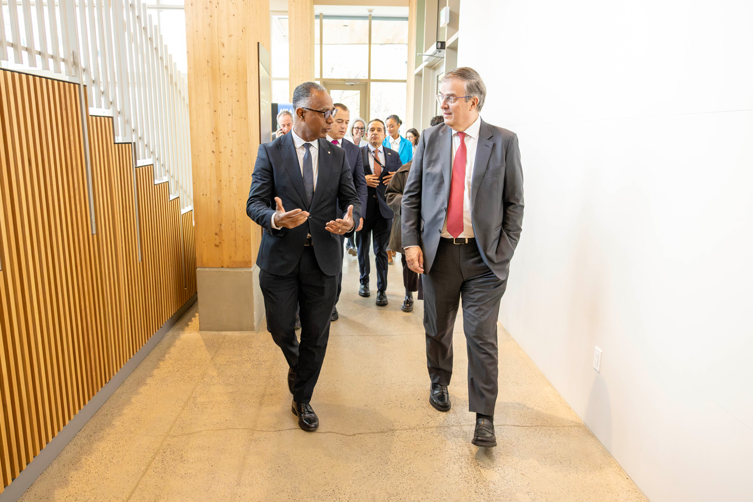 Dr. Fearon chats with the trade delegation on their arrival