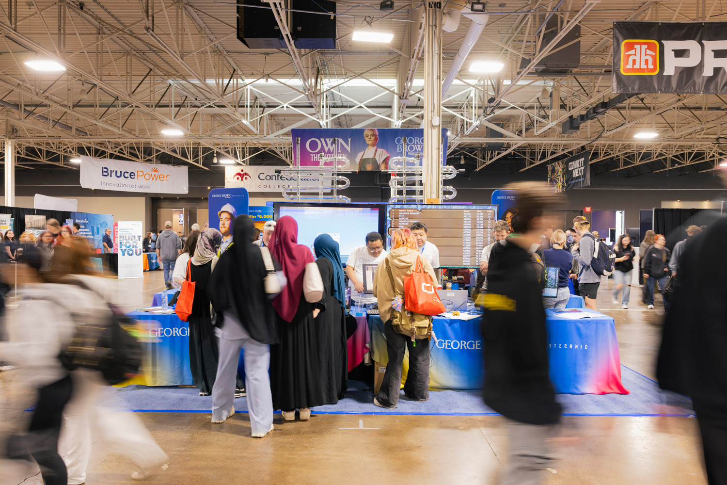 Guests visit the George Brown booth at the Skills Ontario competition.