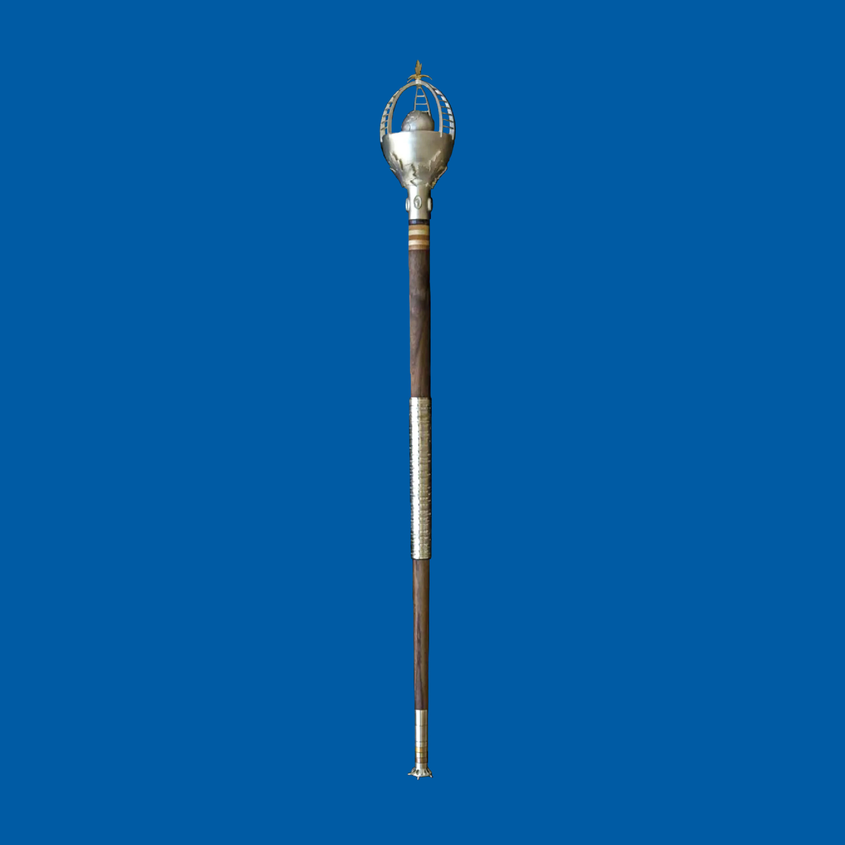 A silver and wooden ceremonial mace against a blue background.