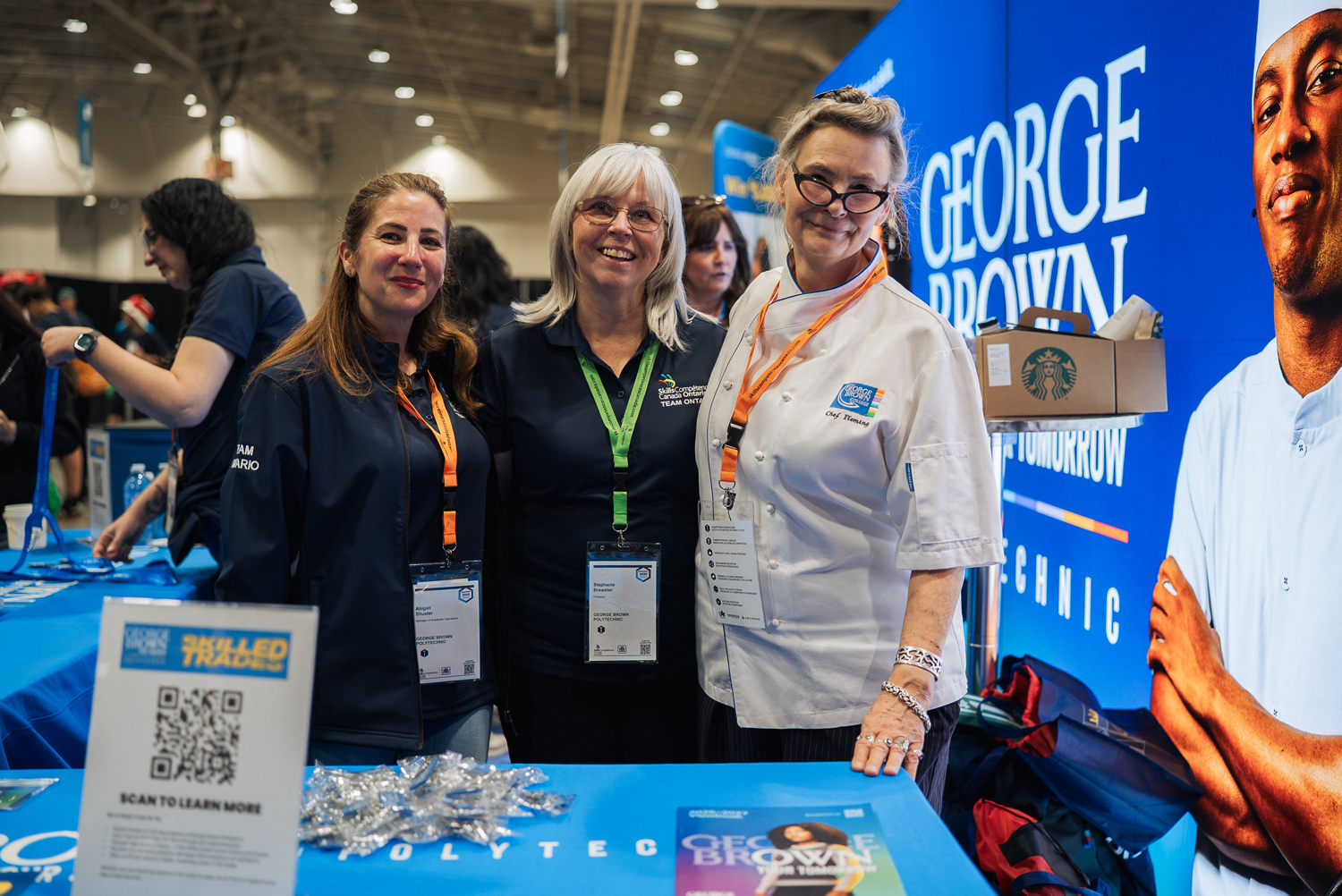 George Brown faculty and staff pose at the Skills Canada booth.