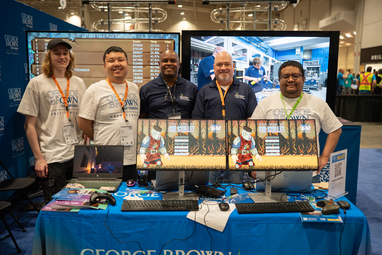 George Brown staff host students at gaming consoles at the Skills Canada competition.