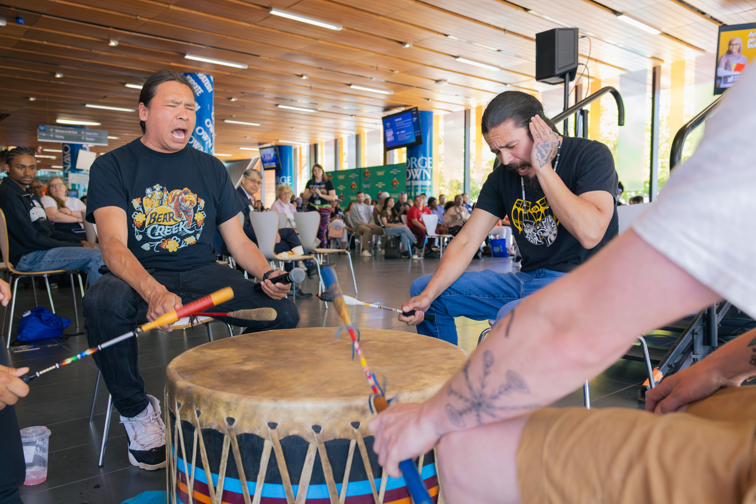 Indigenous drummers sing an honour song at the Indigenous History Month kickoff event at George Brown's Waterfront campus.