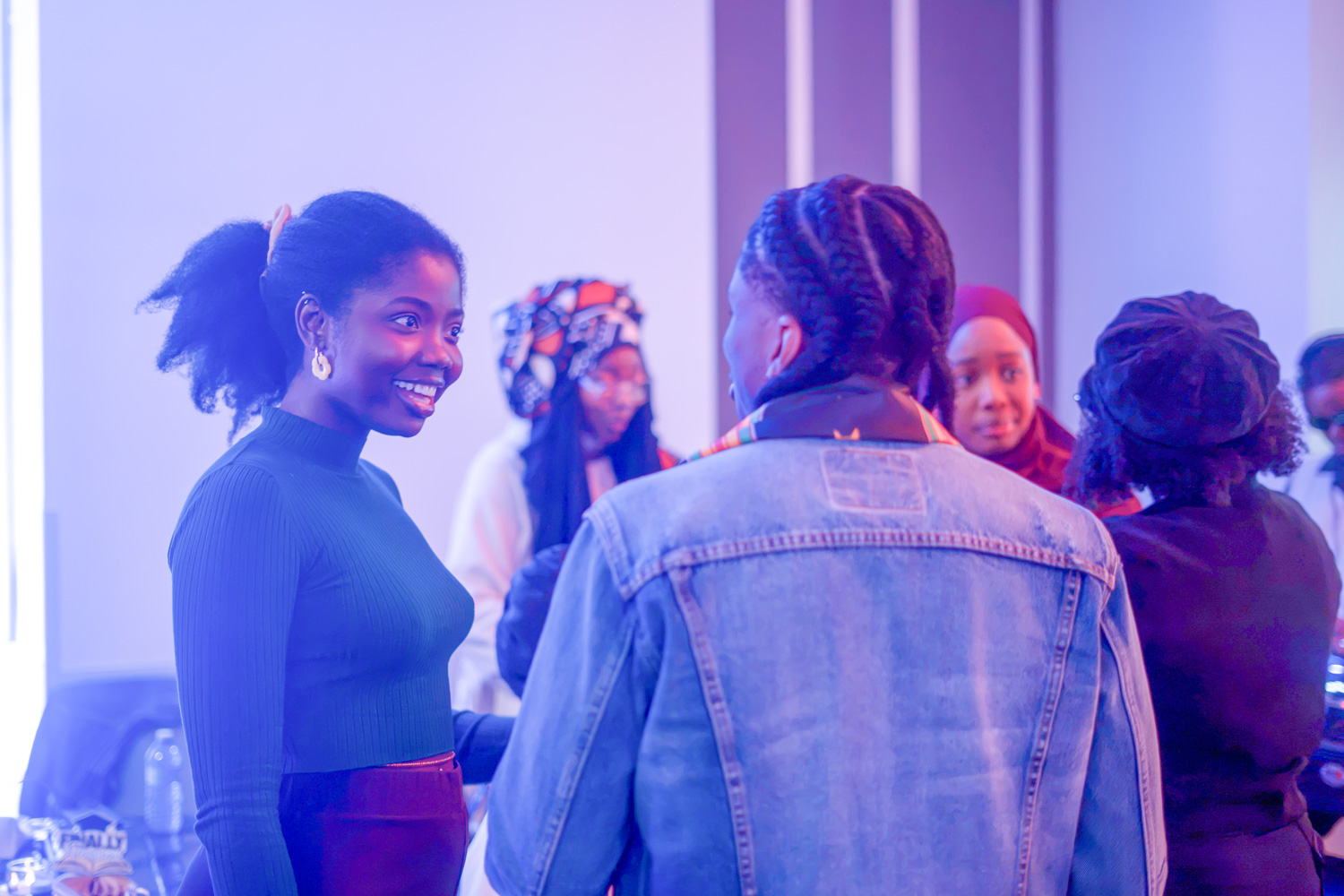 New grads chat with their peers at the Legacy in the Making event.