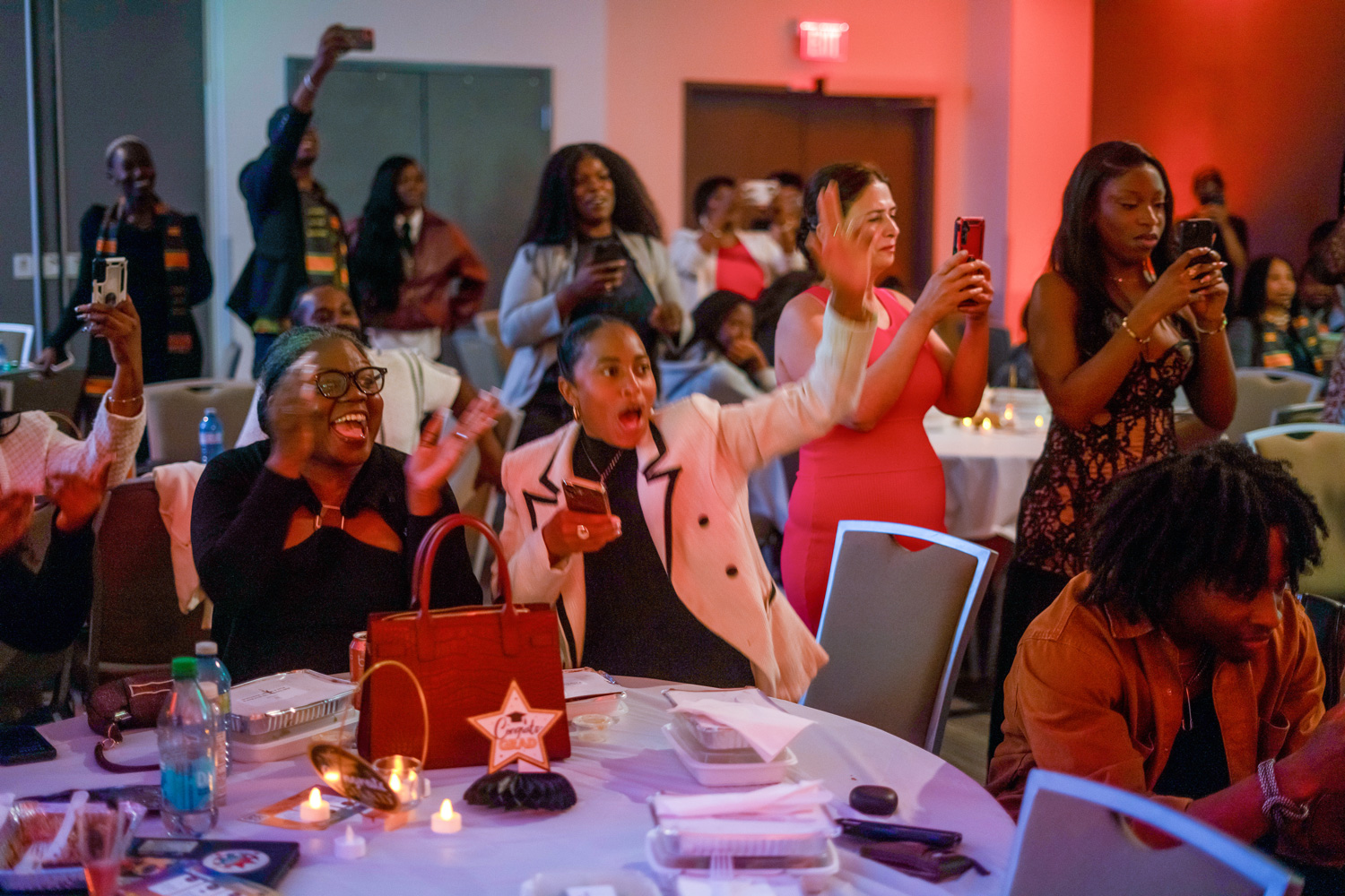 Guests at the Legacy in the Making event celebrate and cheer the newest grads.