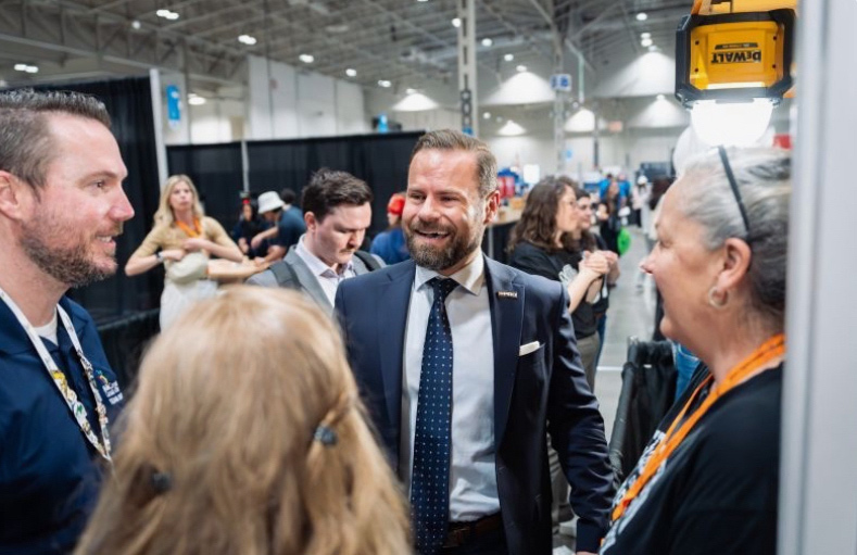 Minsiter Piccini visits the George Brown booth at Skills Canada.
