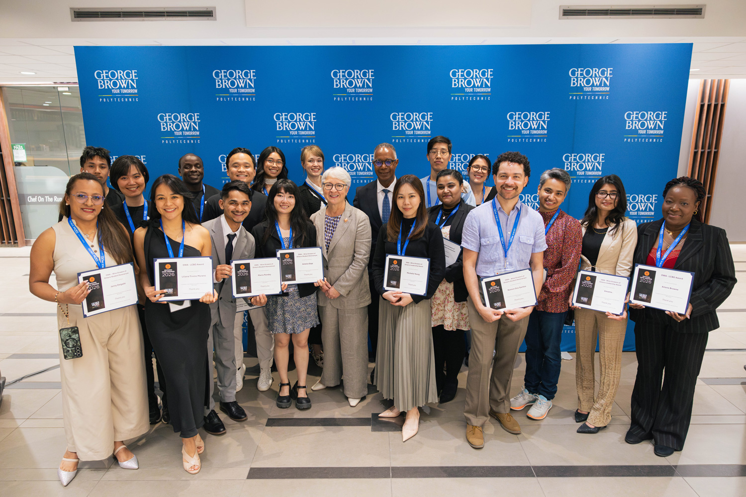 Student bursary winners hold up their certificates at the Ontario Wine Awards.