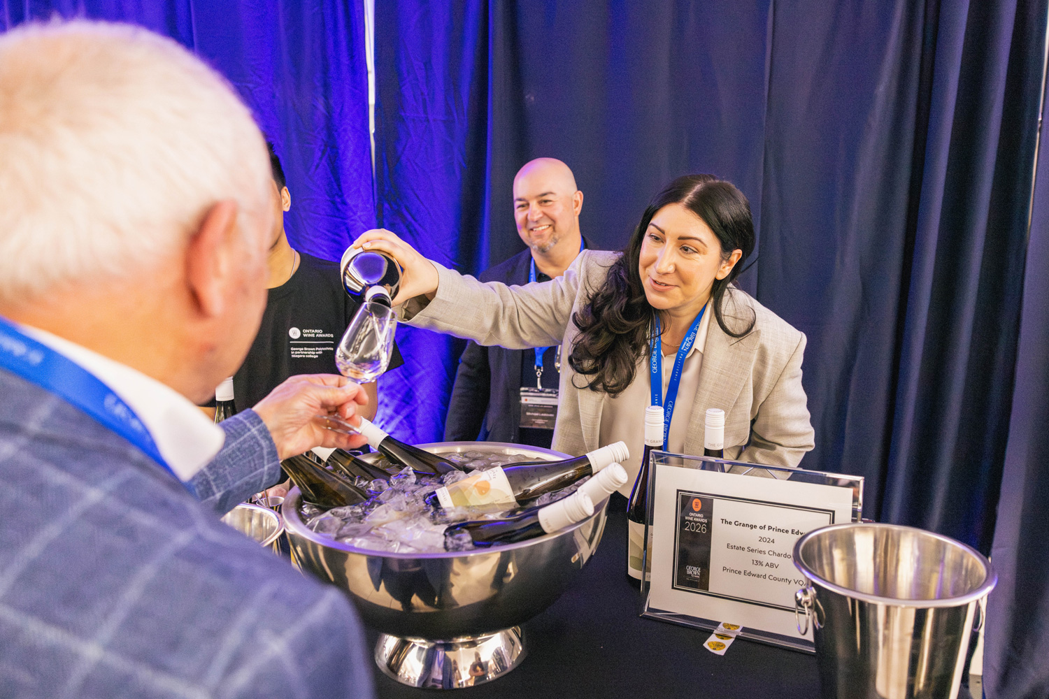 Guests taste the Grange of Prince Edward's winning wine at the Ontario Wine Awards.