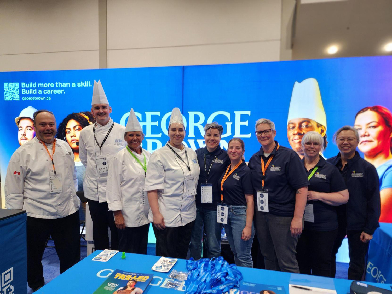George Brown's chef faculty and staff pose at the booth at Skills Canada.