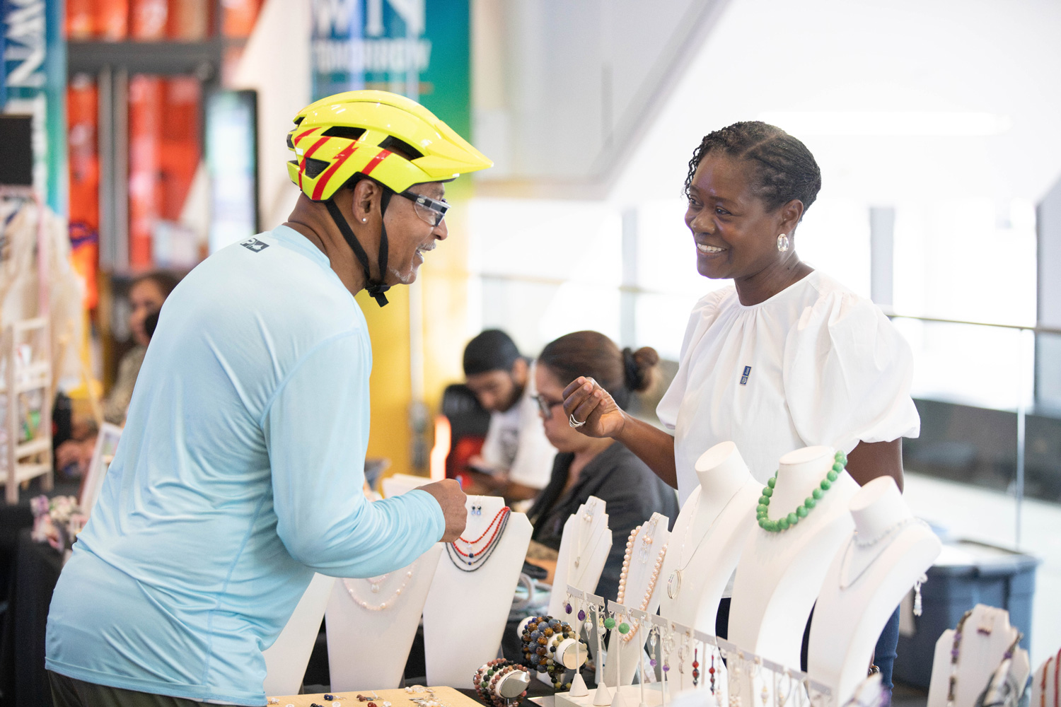Guests chat with alumni vendors at the Summer Sounds at George Brown event.