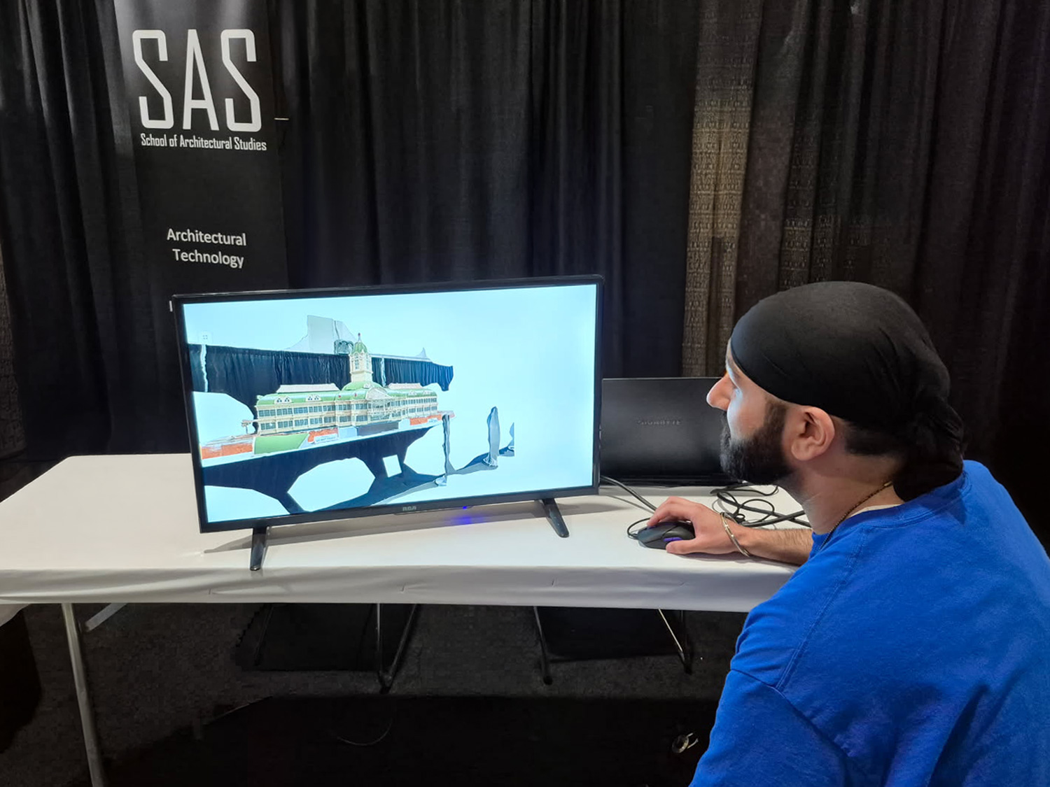 A student uses software to model a 3D scan of the Crystal Palace at the CNE.