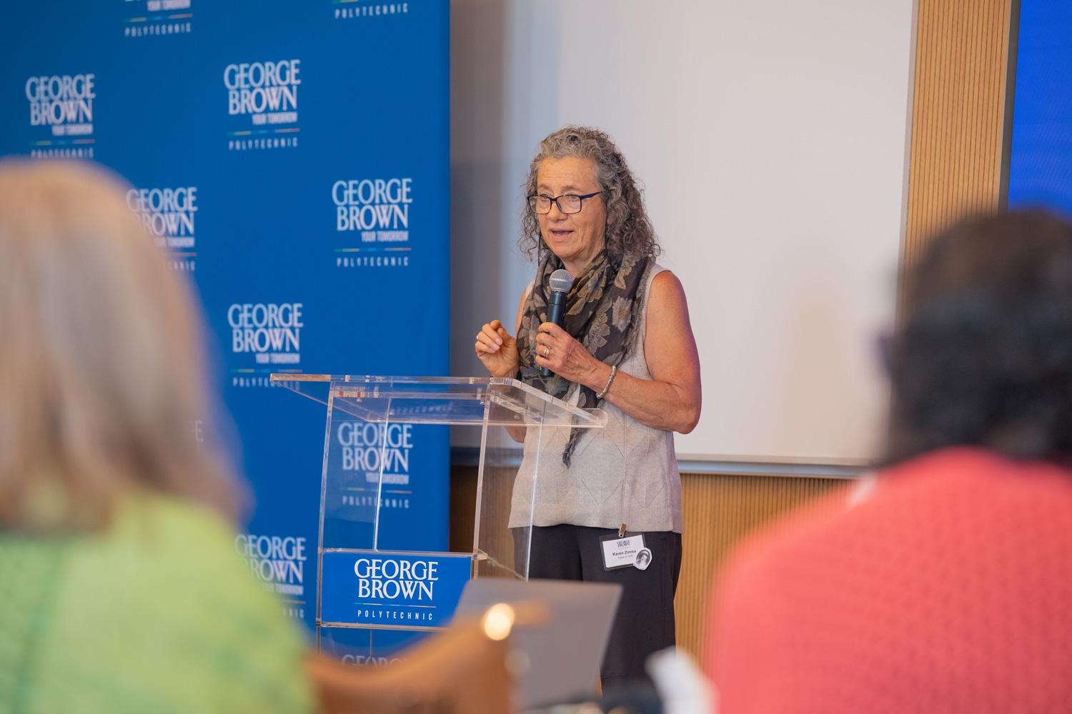 1976 nursing grad Karen Zimba speaks to her fellow classmates at the 50th reunion event at George Brown.