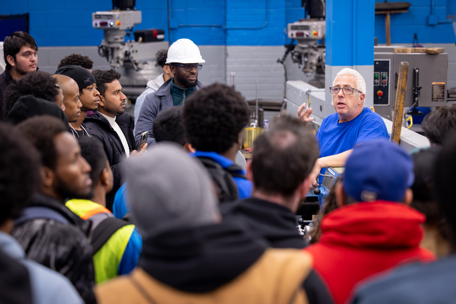 Day of discovery guests get a tour of the machinging lab.
