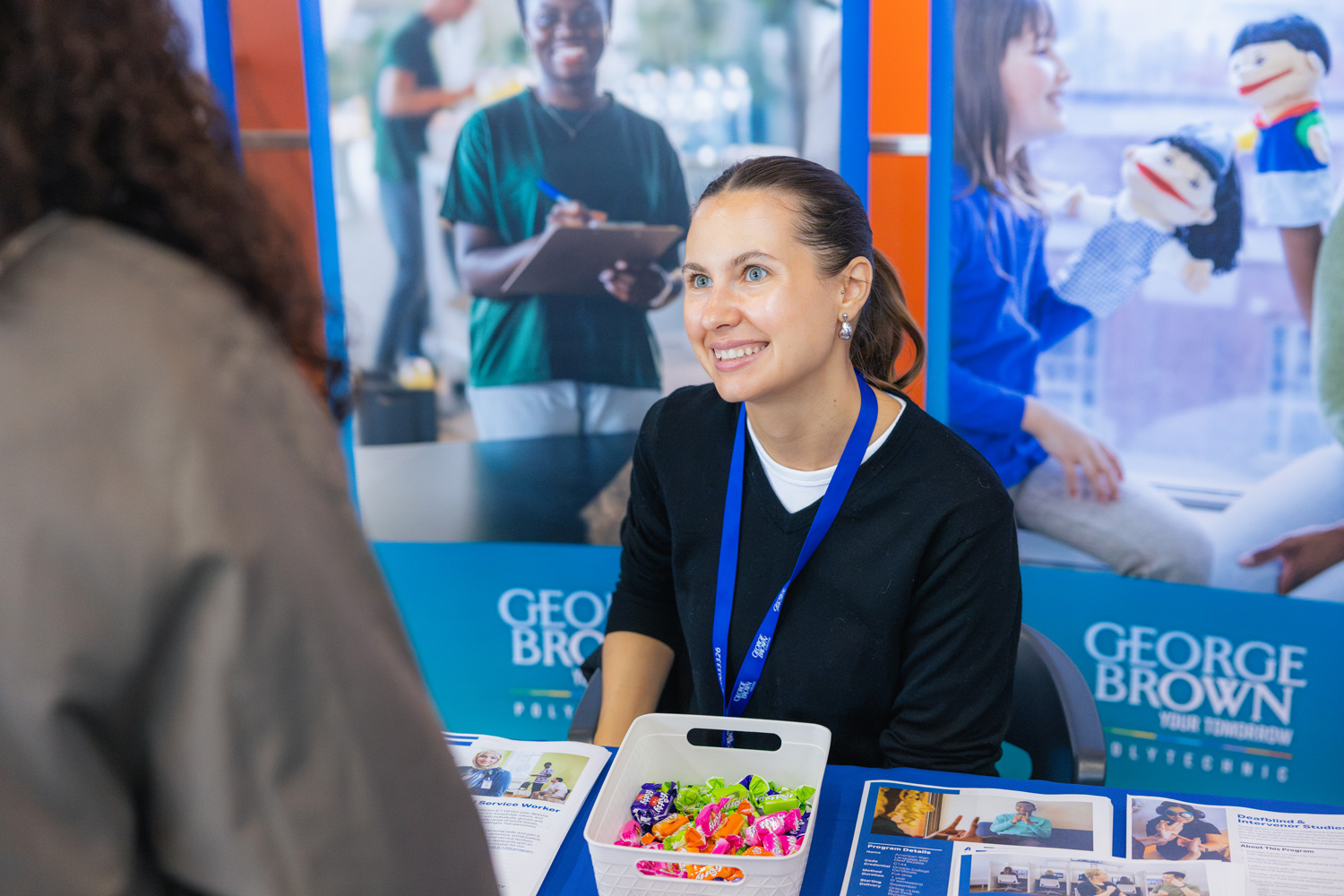 Guests connect with George Brown teams at the Waterfront Campus CIP event.