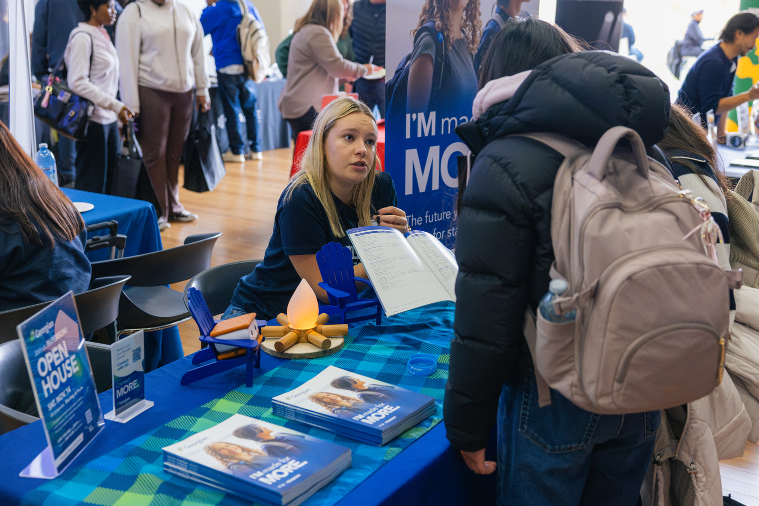Students visit the tables of visiting institutions at the CIP event at the Waterfront campus.