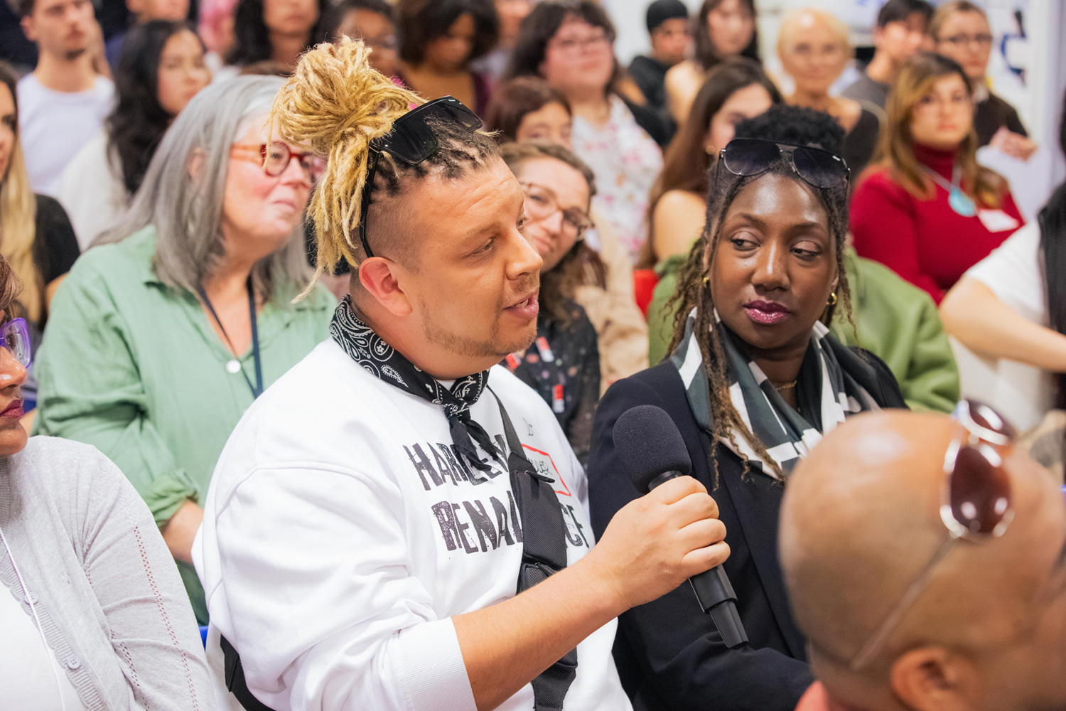 Guests in the audience at the George Sully event at the Fashion Exchange ask questions as part of the Q&A portion.