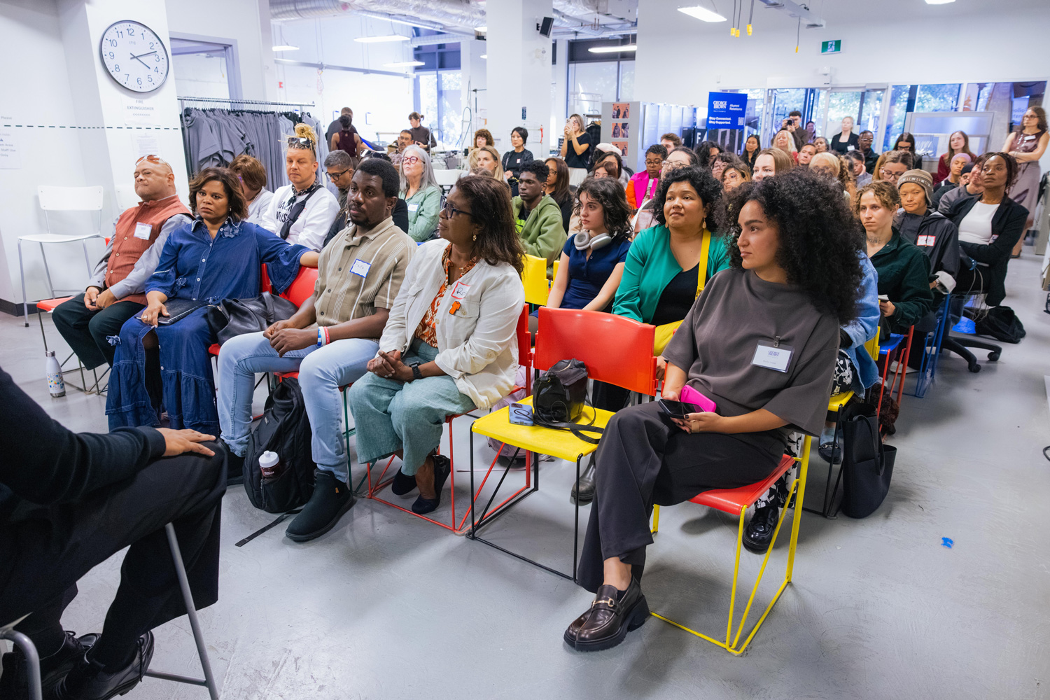 The Fashion Exchange hosts a full house of seated guests for a fireside chat with George Sully.