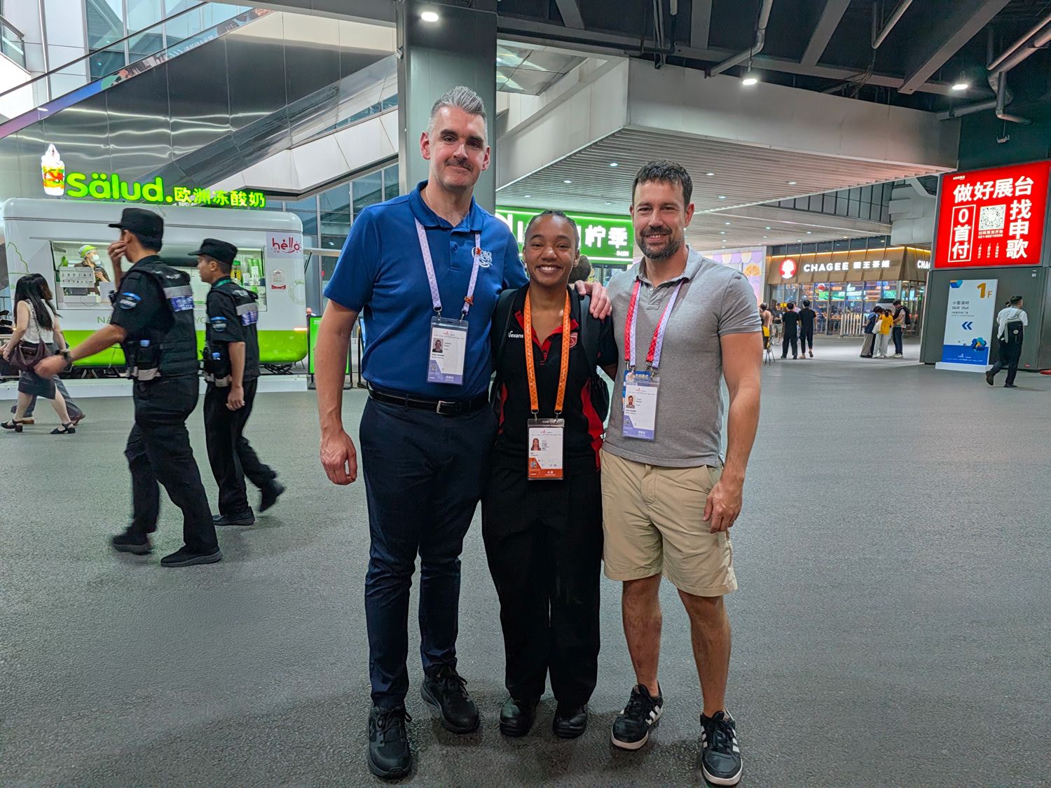 Luca Assad poses with her George Brown coaches at WorldSkills in Shanghai.