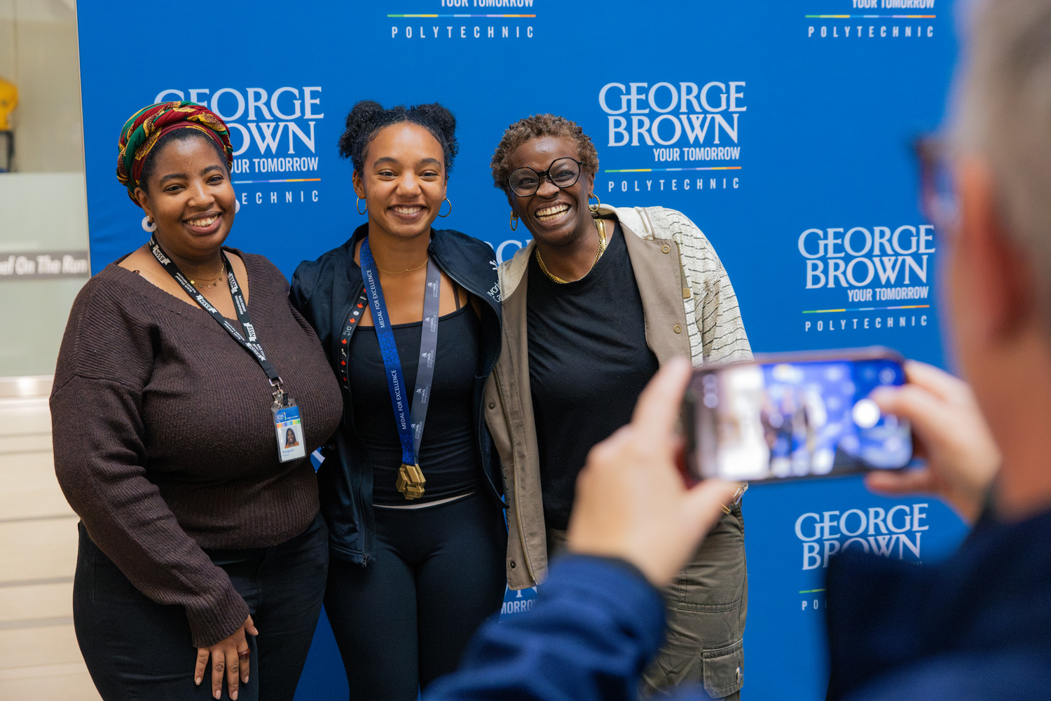 Luca poses with members of the George Brown community at the welcome back gathering.