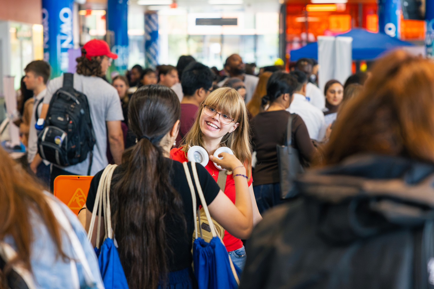 Prospective students and visitors to the Waterfront Campus engage with staff, faculty, and students at an open house event.