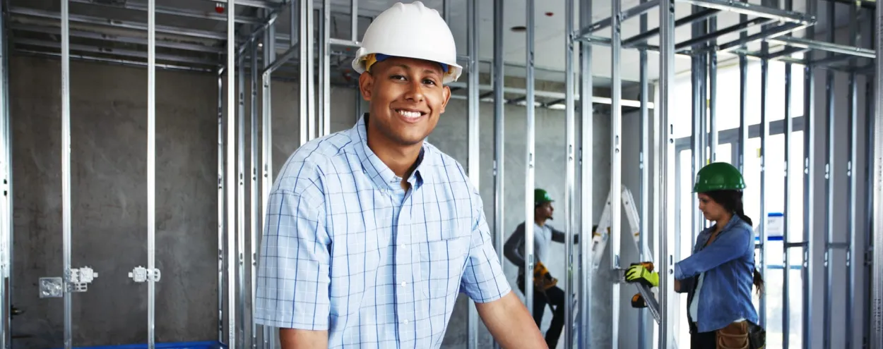 Male construction student hero shot on site.