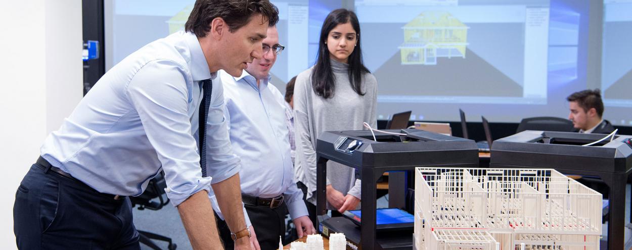 Prime Minister Justin Trudeau in BIM lab with two students