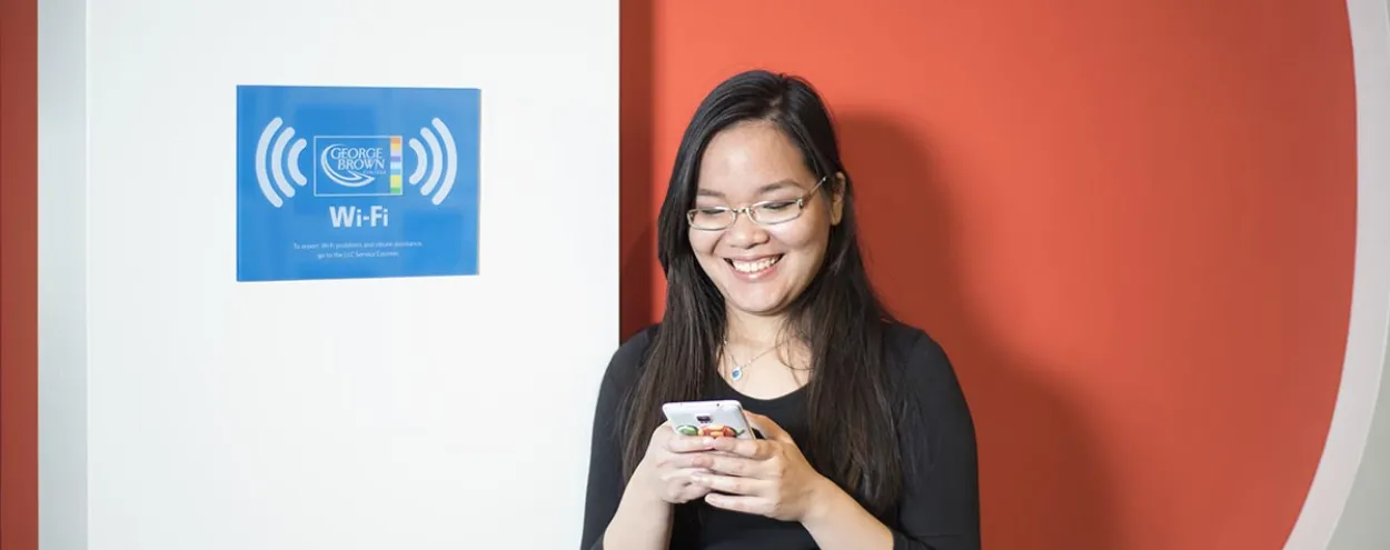 female student looking at phone
