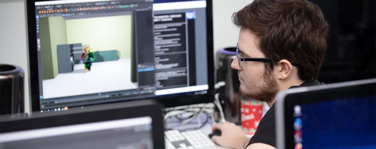 male student working on computer animation