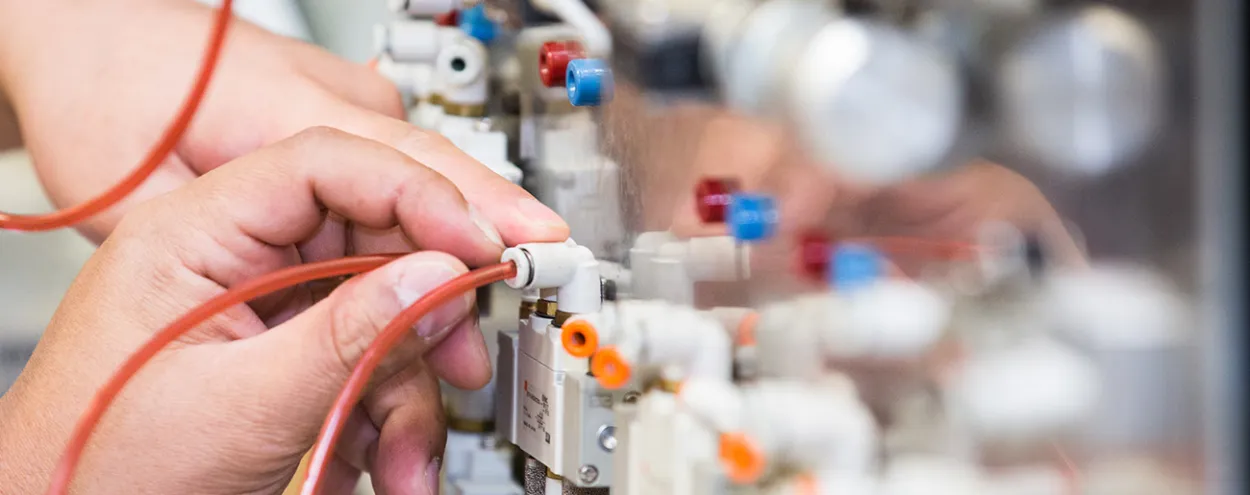Hands working on an electrical project
