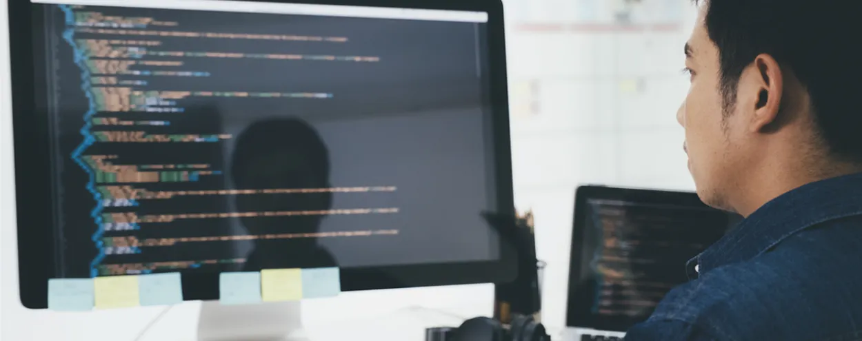 A student of the School of Computer Technology working at their computer