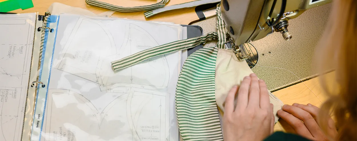 hands working at sewing machine