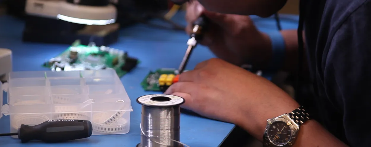 A student at work on a textile project