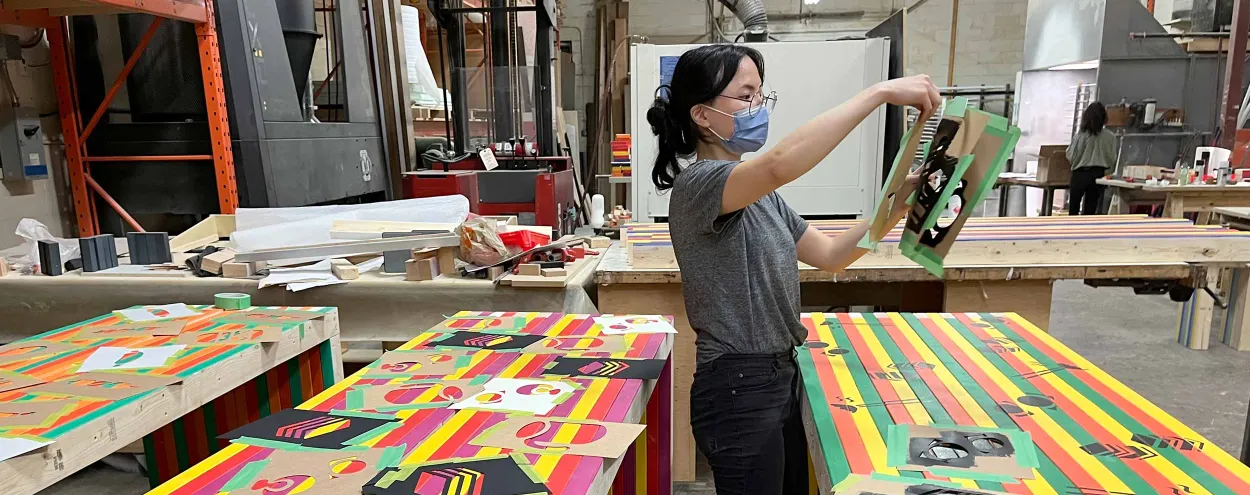 Graphic Design student working on Smorgasburg Toronto tables