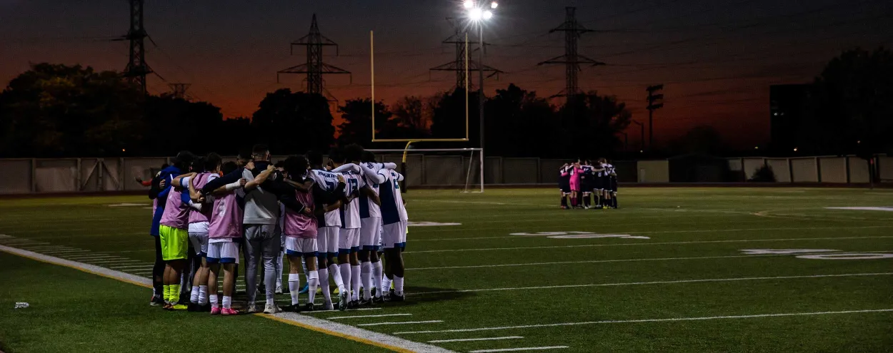 OCAA men's soccer team on the field, October 2022