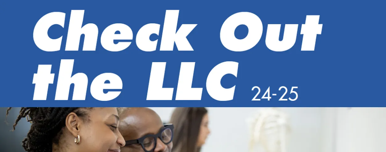 Check out the LLC written in text, with two people smiling and looking at iPads