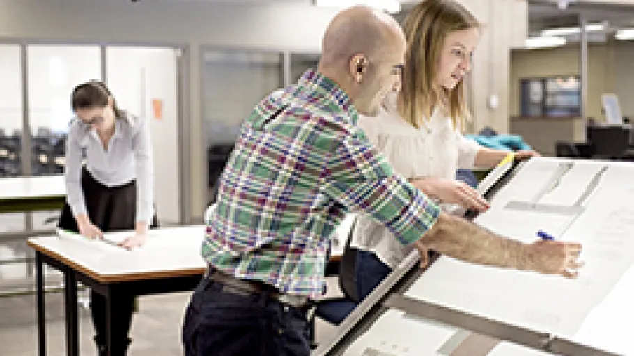 Students working at a drawing board