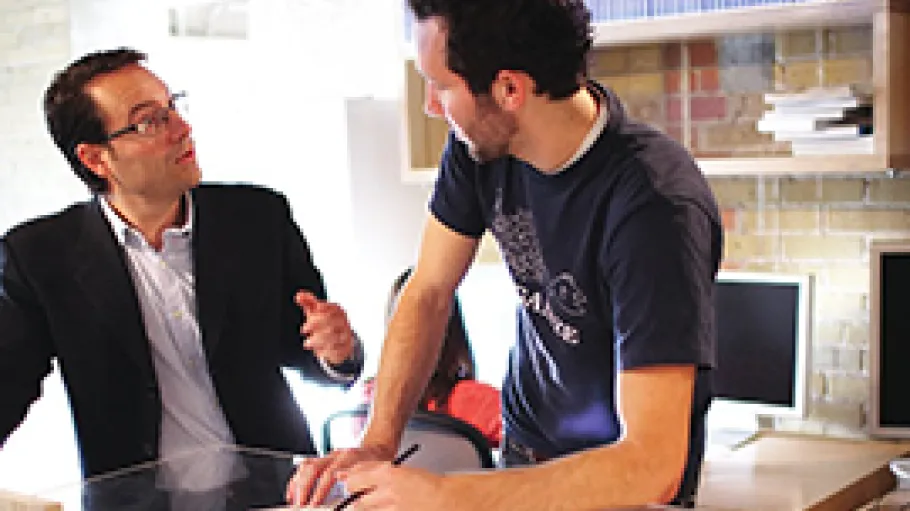 Industry partner and student conversing