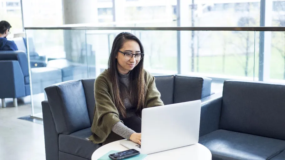 female student using laptop
