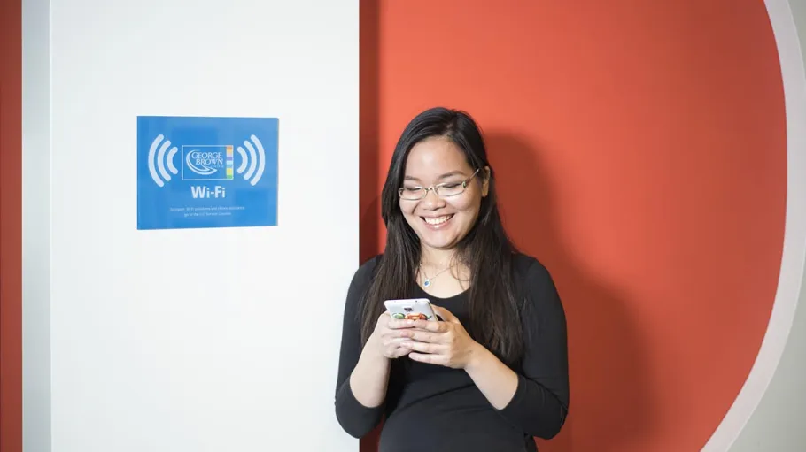 female student looking at phone