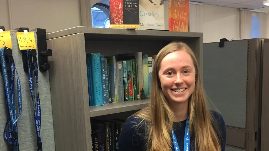 A tutor smiling in the Tutoring and Learning Centre