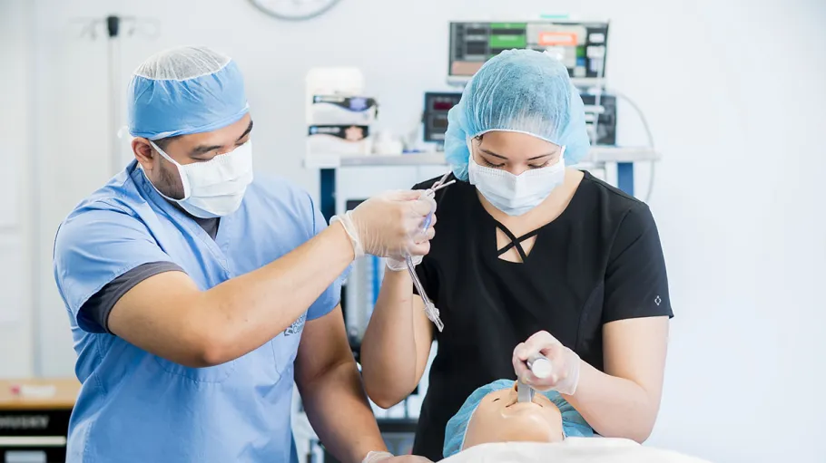 2 students working in health sciences simulation centre