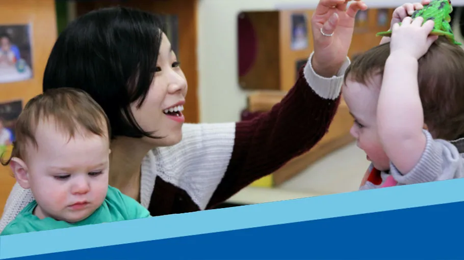An Early Childhood Education student plays with children.