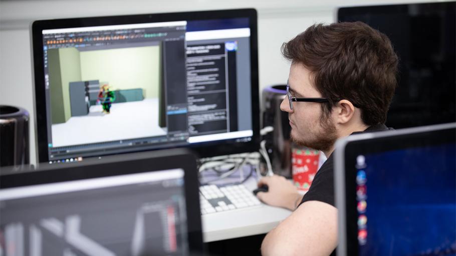 male student working on computer animation