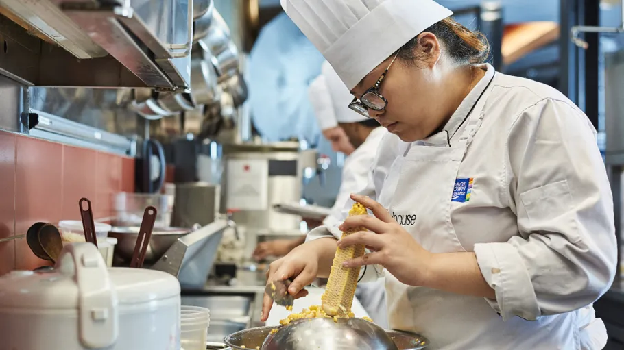 Student preparing food at The Chefs House