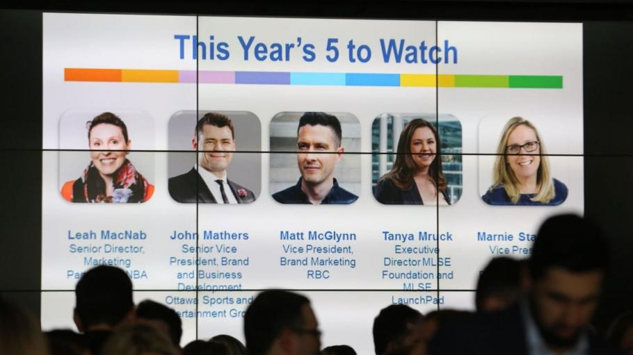 Big screen showing 2018 5 to Watch award winners