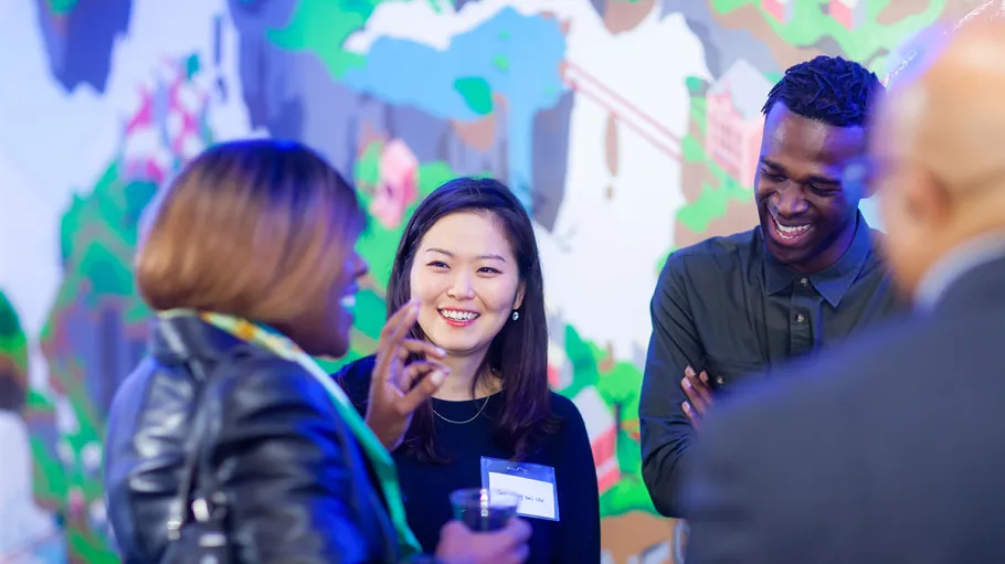 Three students laughing